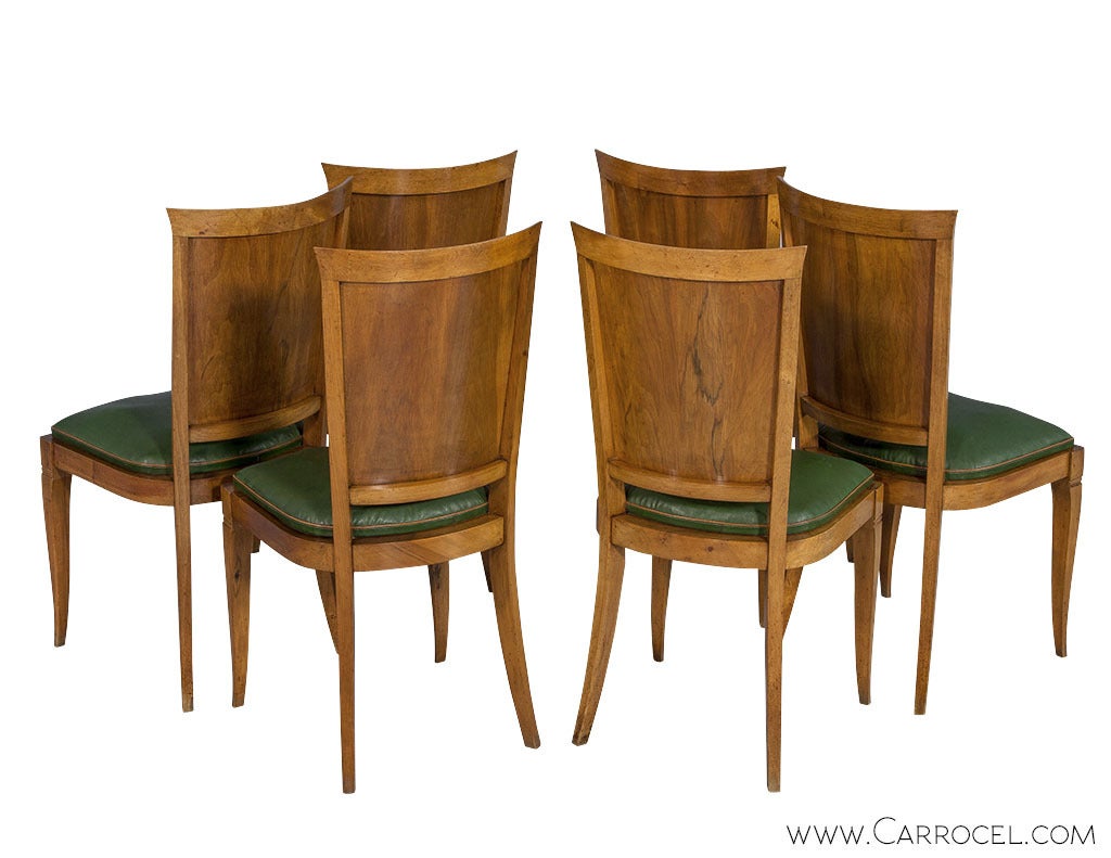 Original French Art Deco dining side chairs, classic Art Deco design with curved back and sculpted flowing legs. These beech wood chairs are in original good condition displaying a rich patina with original Kelly Green leather.