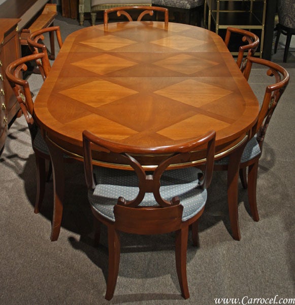 This is such a unique mahogany dining set. It was made in the 1960s by the Johnson Furniture Co. of Grand Rapids, Michigan - once a mecca for high quality furniture. This set is made up of totally different and particularly exceptional chairs, and a