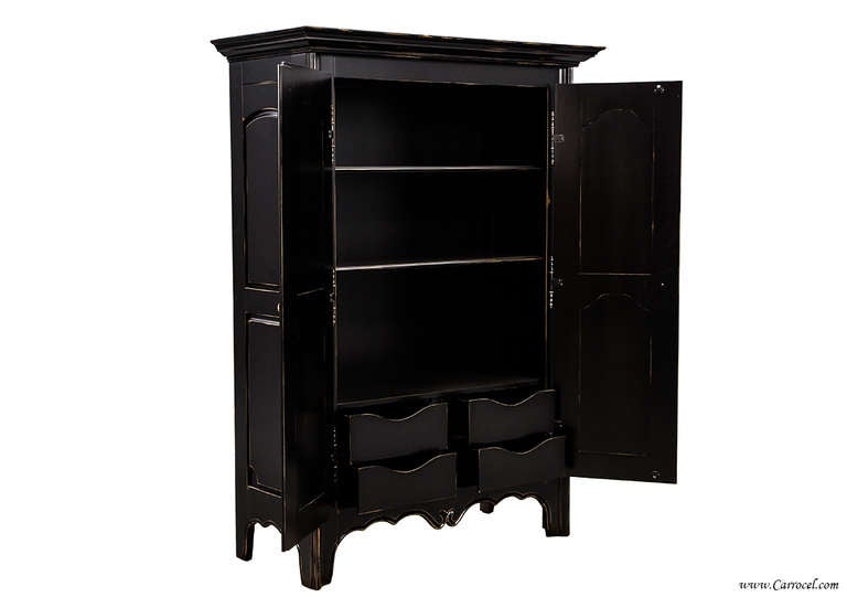 This gorgeous armoire is made from solid maple and finished in a stunning flat black lacquer with hand-distressing.  In pristine condition, this newly made Canadian piece makes a great addition to your bedroom, hallway, or mudroom.  It offers an
