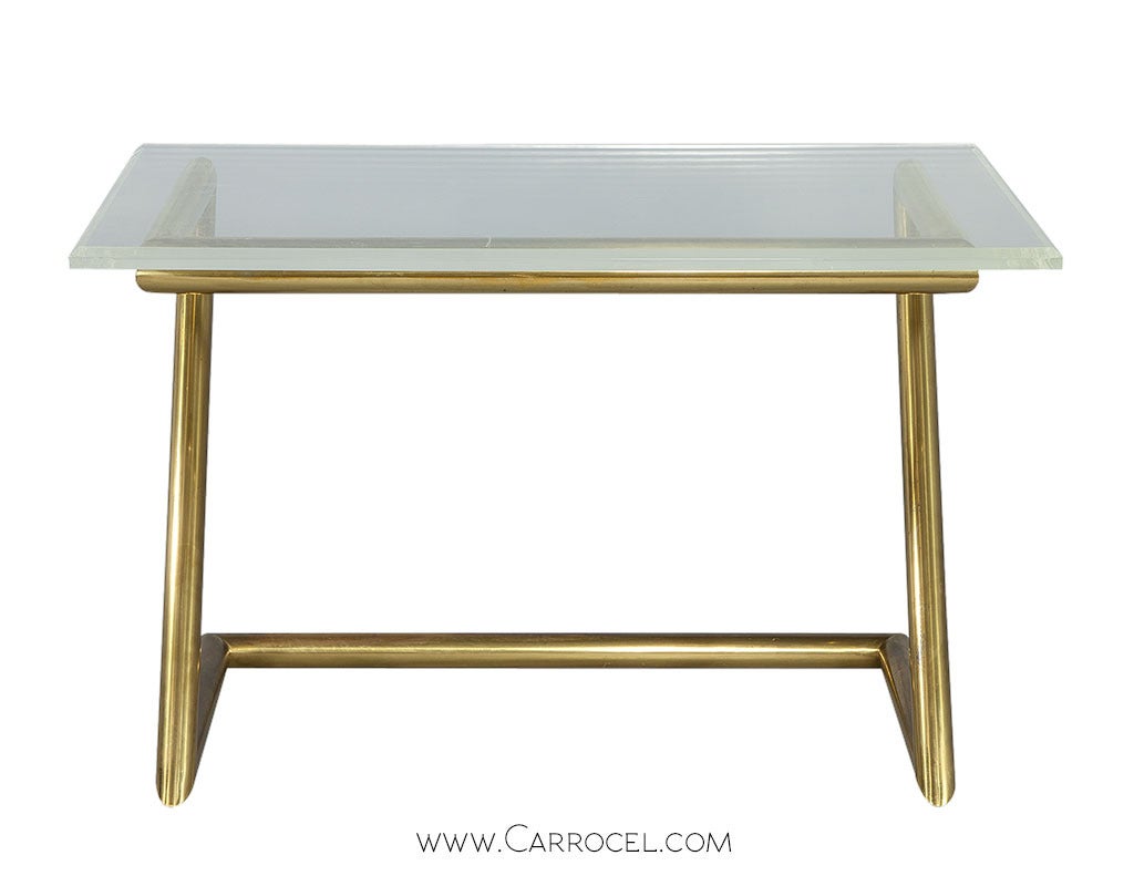 Vintage bevelled edge lucite acrylic top on a brass cantilevered Z-frame desk.