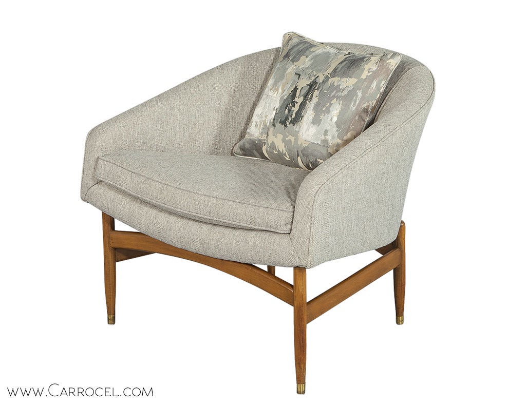 Newly reupholstered and now a part of the Carrocel Revival Collection is this gorgeous barrel back accent chair. This chair was created in the 1960s with a classic look attributed to Milo Baughman. The new upholstery lends new life to this chair,