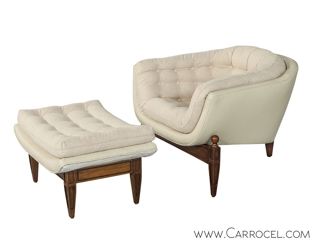 Mid Century Modern Adrian Pearsall style Tufted Barrel Chair and matching Ottoman newly upholstered with a soft cream wool interior and leather exterior raised on the original walnut tapered leg base. Dimensions for chair shown, dimensions for