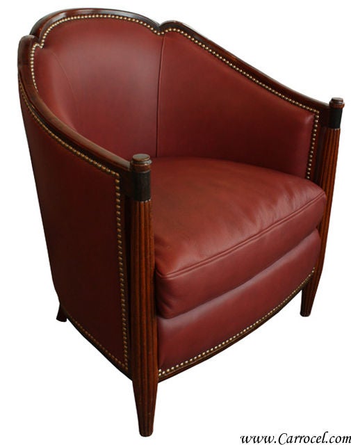 This exquisite Art Deco club chair is from France and has been professionally upholstered in soft Italian burgundy leeather with hand-placed antiqued nail heads.  It is fabulous and very comfortable.