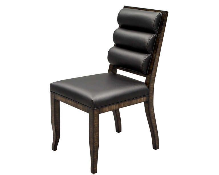 Set of 10 Zebra Wood dining chairs, custom made by Carrocel. Hand polished to perfection, featuring fine black italian leather. Available in custom orders for quantity, wood type, color and upholstery.