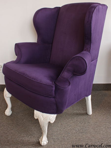 This is a vintage Ethan Allen wing chair that has been restored by our artisans to bring into the 21st century.  Finished in a vibrant modern purple ultra-suede, this chair is so comfortable.  The legs have been refinished in a cream white that
