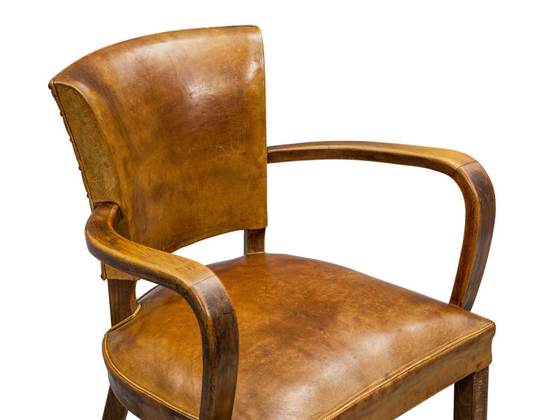 Vintage caramel distressed leather and curved wood frame from France.