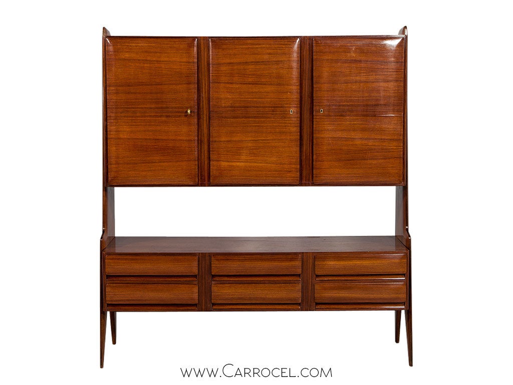 Vintage Original condition Italian Rosewood Mid Century Modern China Cabinet, sideboard, hutch. Very unique example of Mid Century design with top cabinets with generous storage that can serve as a bar cabinet and a 6 drawer lower case set on flared