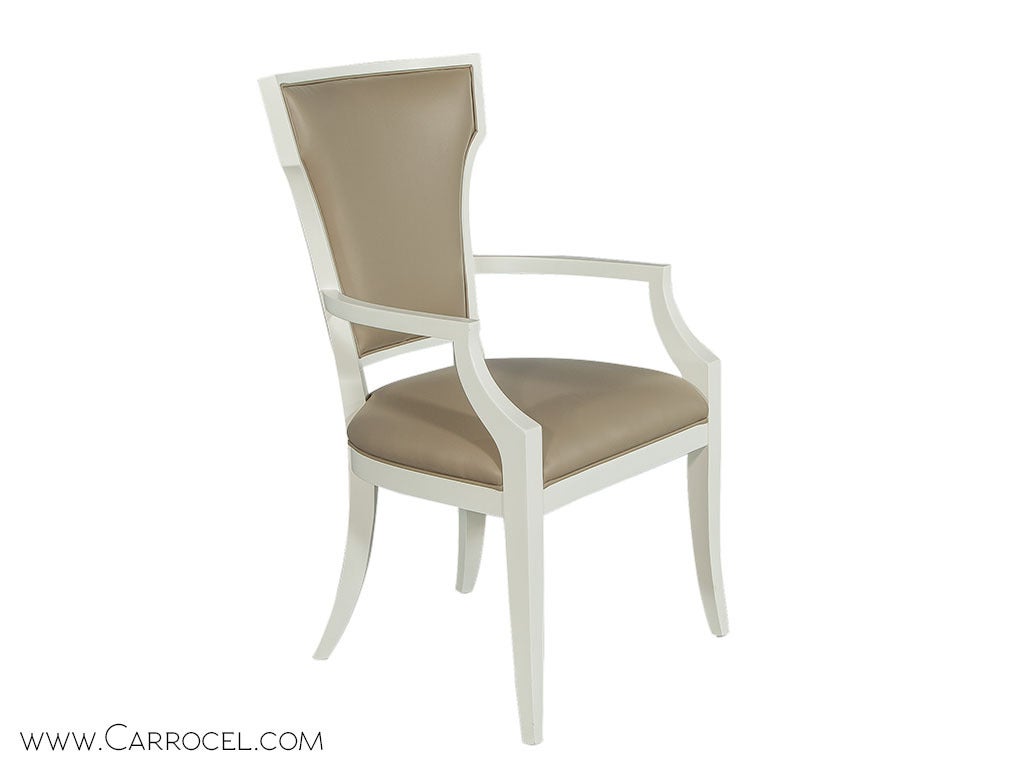 Set of 10, Italian made transitional dining chairs featuring a unique show wood frame with an elegant triangular design and soft curves extended through the leg. The set includes two arm and eight side chairs. Constructed with European beech wood,