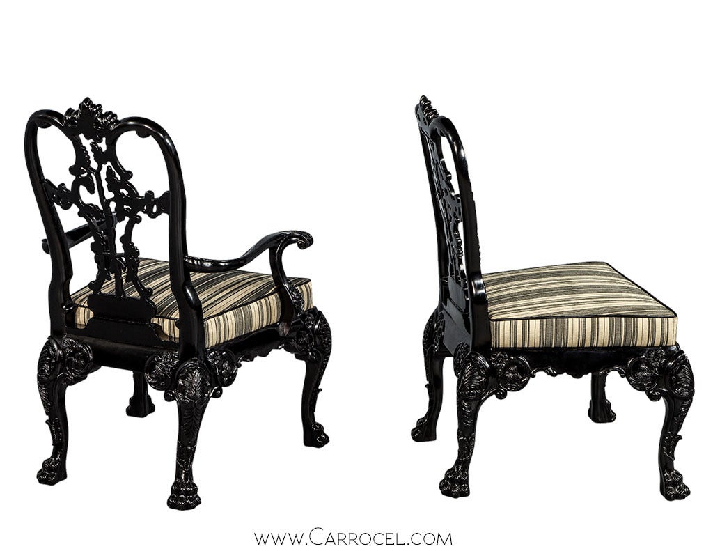 Intricately detailed hand carving with the most artful precision adorns these unique chairs. Made of solid mahogany these chairs have been finished in a hand rubbed and polished ebony lacquer that accentuates the fine detail and precise real life