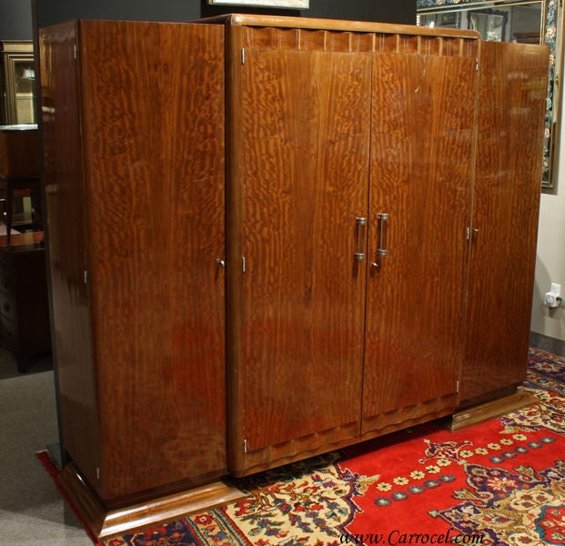 Made in the 1930s and imported from France, this stunning ribbon mahogany armoire is fine example of classic Art deco styling.  It is in original condition and does have some minor scratches consistent with its age but the entire piece will be