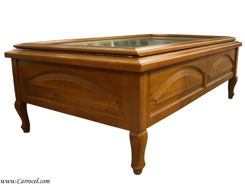 This solid cherry coffee table is newly made by I.M. David Furniture Company.  It is quite unique as it features a removable glass top insert that reveals an actual casino-style craps table, complete with die and a craps stick.  Enjoy the special