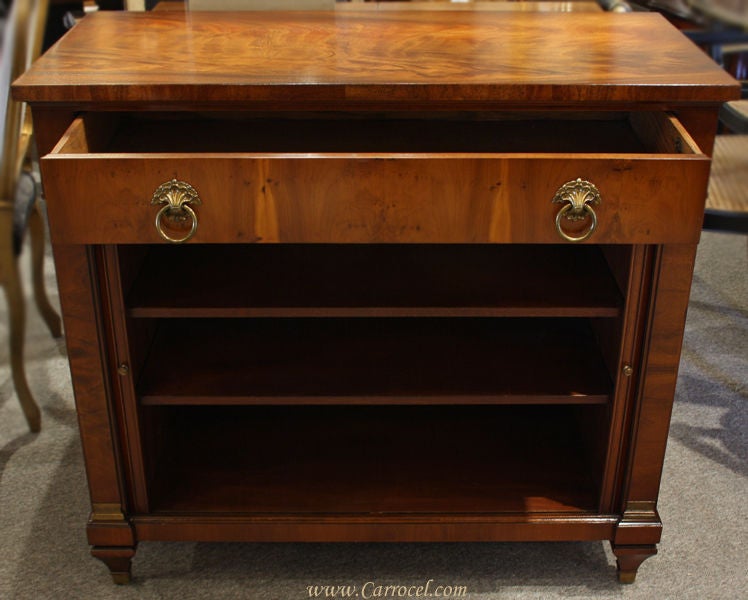 This is an exquisite tambour-door Empire styled commode made by William Berkey of WMA Berkey Furniture Co.  Based out of Grand Rapids, MI, WMA Berkey Furniture was one of the leading fine furniture manufacturers in a city known as the hot spot for
