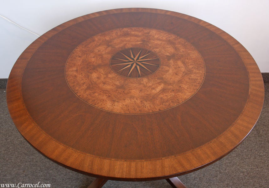 Here is a perfect table for your entrance way or living room.  Made in North Carolina and custom finished by our skilled artisans, this piece features a gorgeous star burst centrefold surrounded by beautiful rosewood, burled walnut, mahogany, and