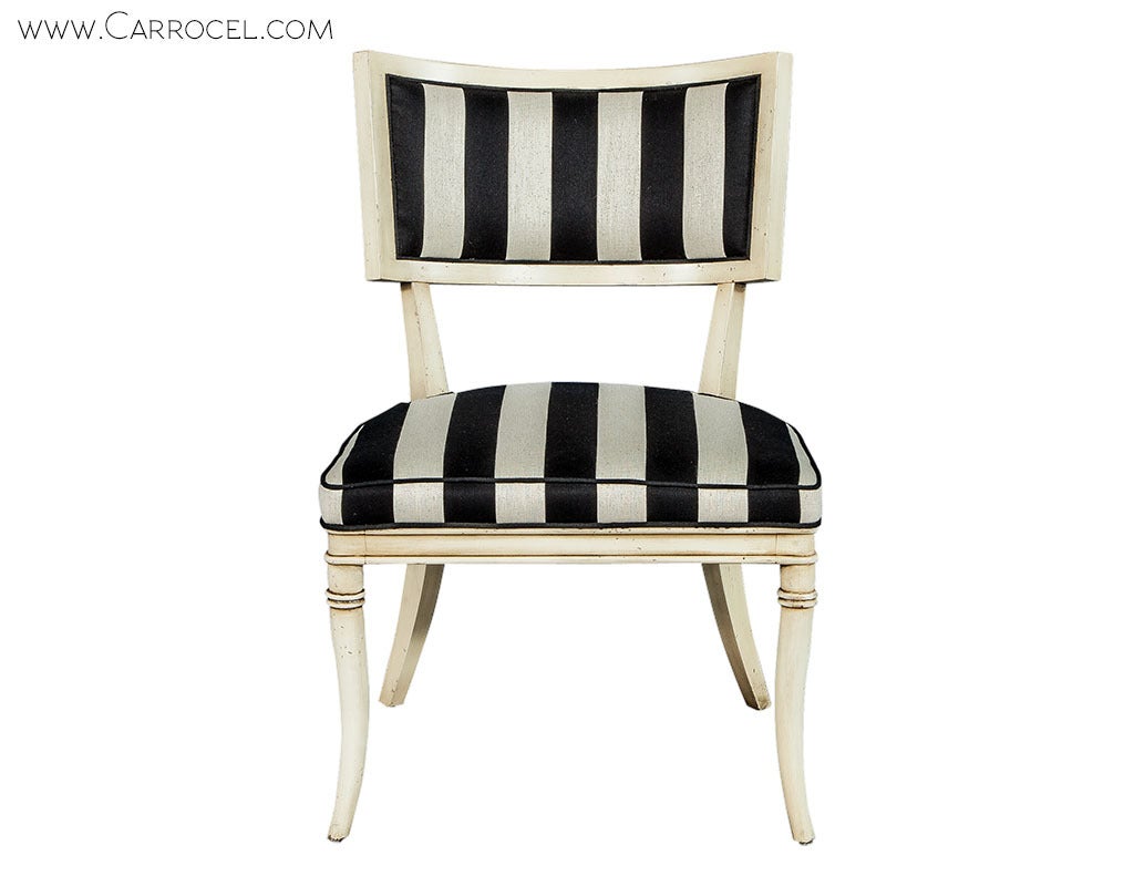 Using the pliability of beech wood, these accent chairs have been designed in the Art Nouveau format with a hint of French Contemporary elegance. With arched backs, saber legs and delicate molding, the frames, finished in distressed white, are set