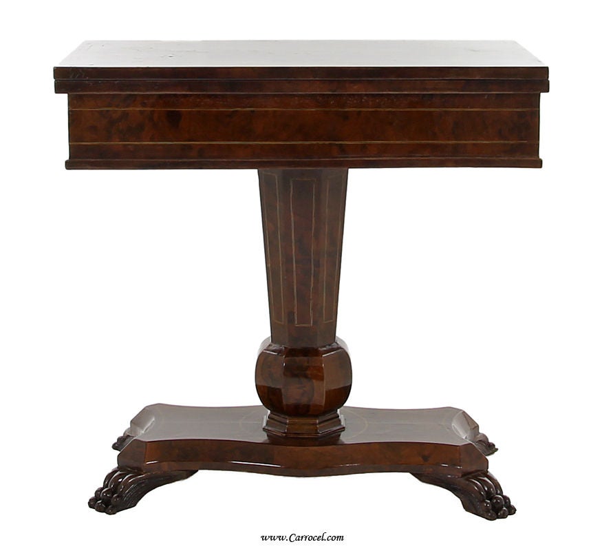 Here we have stunning games table.  Made in France in the early 20th century, this lovely piece has a fold out top with chess and backgammon boards.  It is made with the finest burled walnut and finished in a classic brown that has developed into