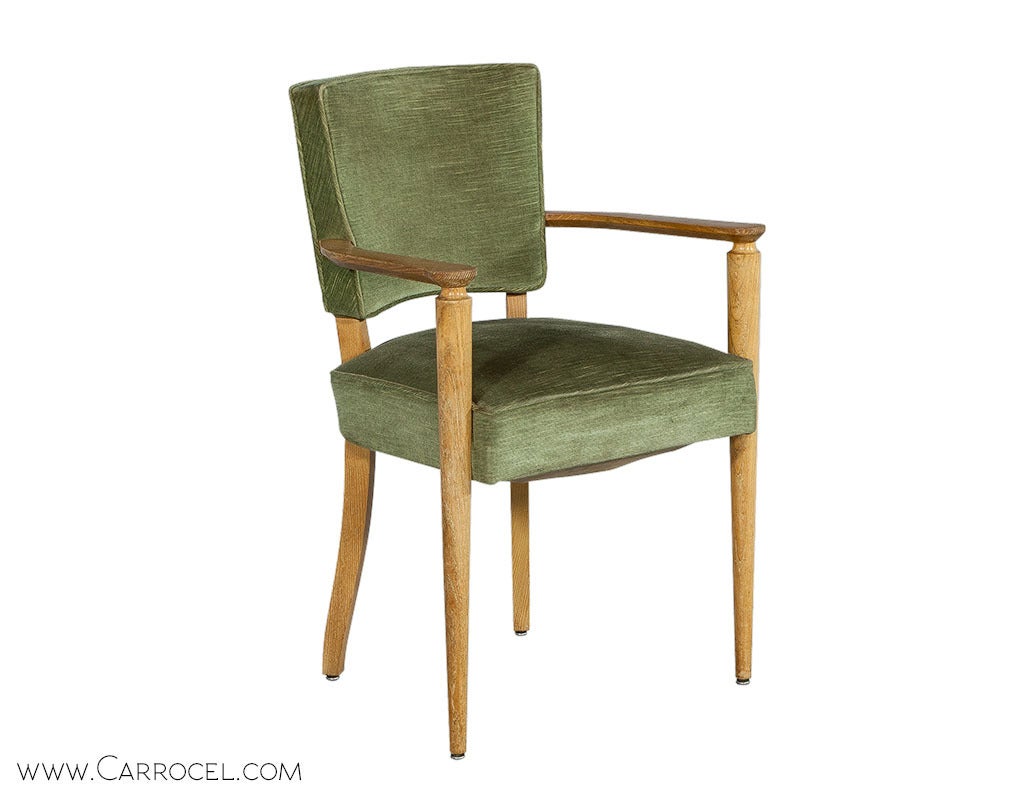 This delectable slice of vintage French Art Deco consists of a set of four original armchairs in excellent condition. Slender beech wood frames with gracefully turned posts and gently curved backs are upholstered in a classic pastel green velvet for