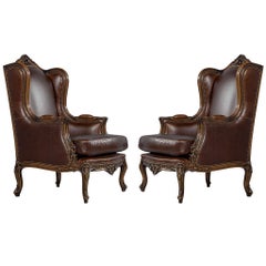 Pair of Mahogany Leather Louis XV Wing Chairs