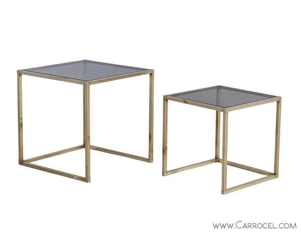 Two delicious nesting tables with all of the ‘Modernist Glam’ characteristic of furniture produced by design house Romeo Rega in the 70s. A simple design consisting of rectilinear steel frames is stylishly finished in brushed brass and capped with a