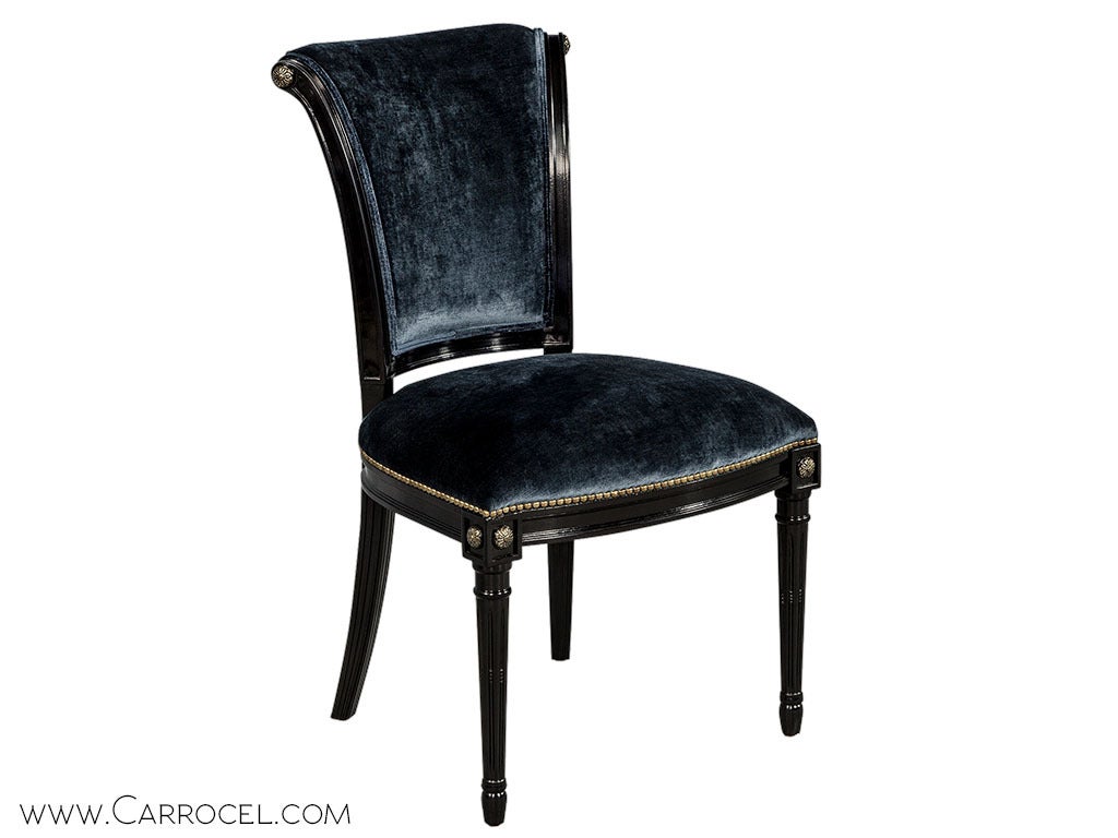 Stunning regency style dining chair with a hint of Louis XVI inspiration found in the turn fluted leg and small carved floret motif accents. The gently curved ergonomic back paired with a deep seat provides a comfort to relax for hours of
