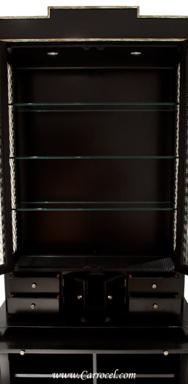 Custom finished in a contemporary black lacquer along with hand-applied antiqued silver leafing, this beautiful cabinet was made by E.J. Victor out of North Carolina and finished by our expert artisans here at Carrocel.  It is exceedingly well made