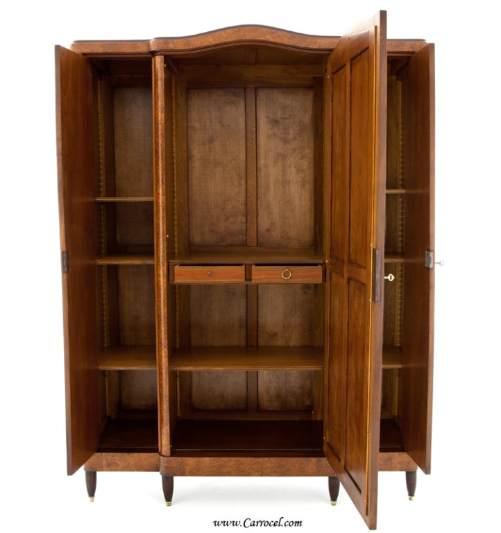 This stunning piece is one of our newest additions to our showroom.  It is an armoire that was made in France in the early 20th century and has been completely restored by our veteran artisans.  It has exceptionally gorgeous wood with bookmatched