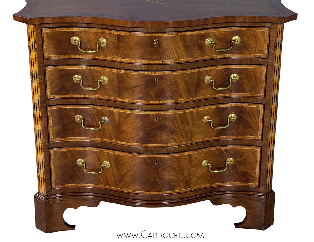 Make your bedroom exclusive with this collector’s edition pair of Baker chest of drawers. Built in mahogany with weighty proportions, each well-preserved piece has serpentine front and straight sides, four drawers with brass drop handles, and