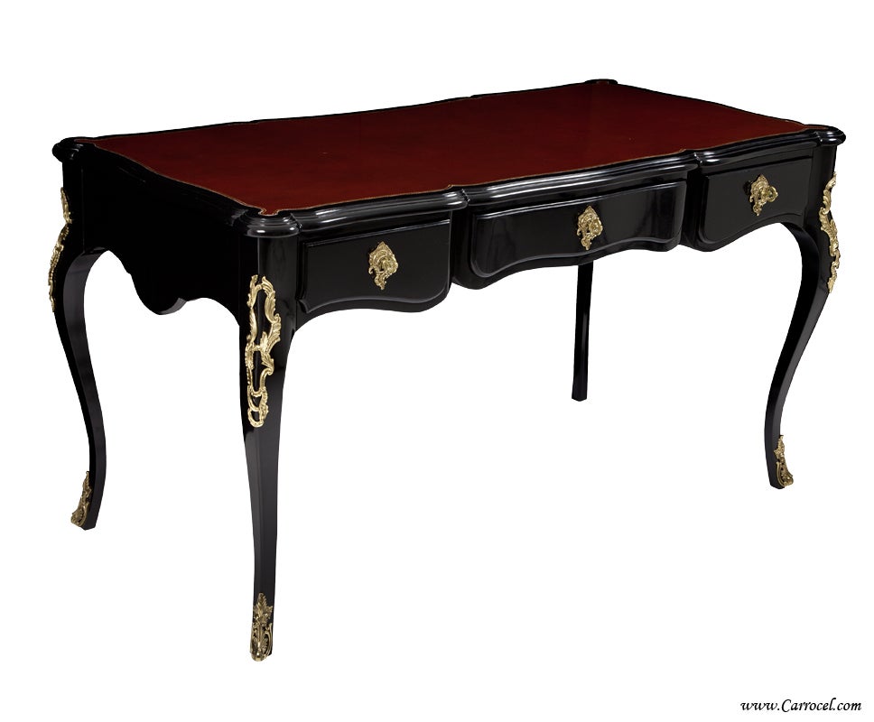 Here we have a beautiful writing desk by Ralph Lauren.  Made by the expert craftsmen at EJ Victor, this desk features classic Louis XV styling and a luxurious ruby leather top with a gold tooled border.  Finished in a high gloss polished black