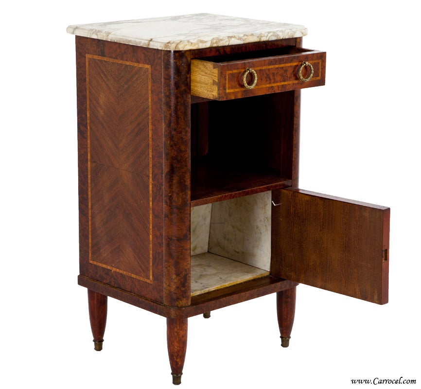 This single nightstand rests alone, unfortunately, with no matching sister.  However, she stands alone beautifully with her burled walnut construction, original marble top, and French pedigree.  In very good condition given it's about 100 years old,