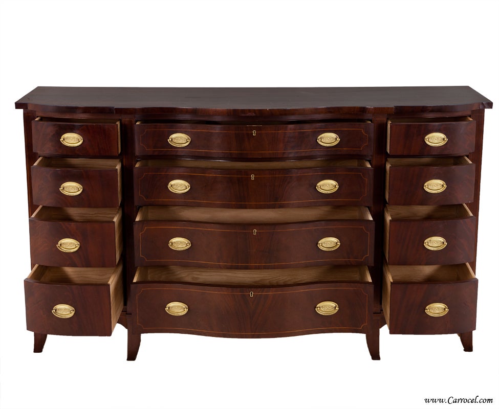 This is a mahogany bedroom dresser made by hand by HICKORY CHAIR.  Still in business today, they have built a long lasting reputation of quality made pieces.  In beautiful condition, this piece features flowing crotch mahogany with mahogany solids. 