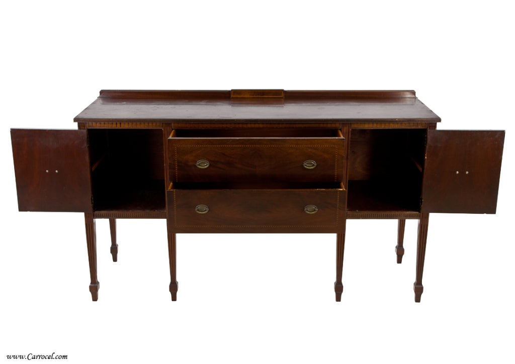 Classically styled with timeless Hepplewhite design, this sideboard is a great piece for a contemporary or traditional setting.  Fine furniture is not made with the quality and care of an era that this sideboard comes from.  We see finely chosen