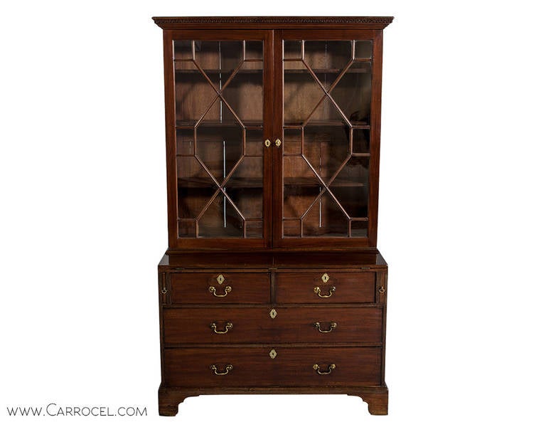 Mid 18th century english mahogany bookcase. Featuring original brass hardware, glass and finish. Completely original, excellent condition.