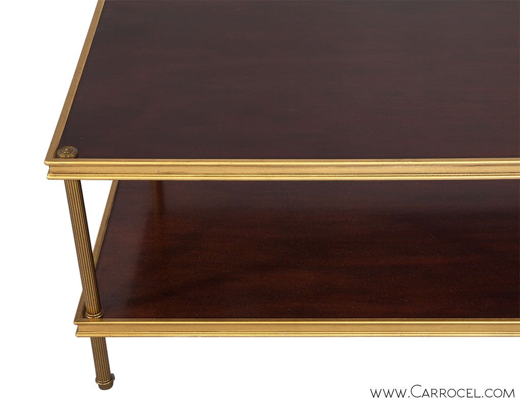 Designed by Ralph Lauren, this gorgeous little cocktail table has a perfect balance between old world traditional and new transitional. With a lower shelf there is room for storage and display, with casters the table has mobility and with rich