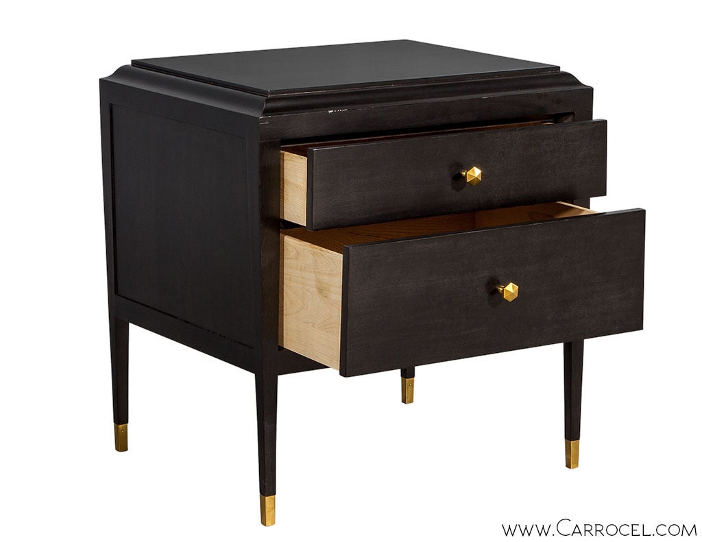 Hickory Chair Andrew side table features a sleek, tapered profile terminating with Hampton Brass ferrules, two drawers with octagonal Hampton Brass pulls and a slip matched beeswing primavera top. This elegant side table is finished on all four sides