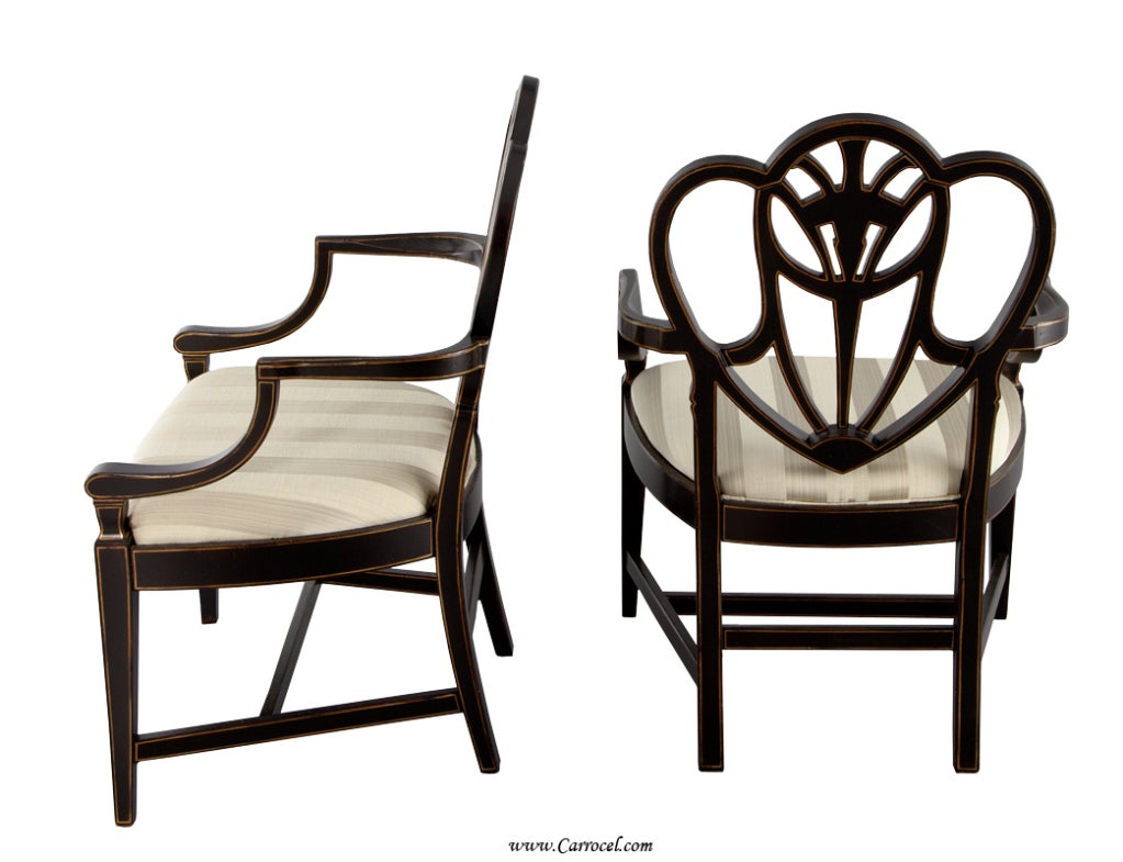 This is a pair of beautiful hand-painted chairs by EJ VICTOR and part of the Julia Gray Collection.  Finished in an exquisite antique black lacquer with hand-painted floral and gold accenting, they are the perfect accent/corner chairs.  The detail