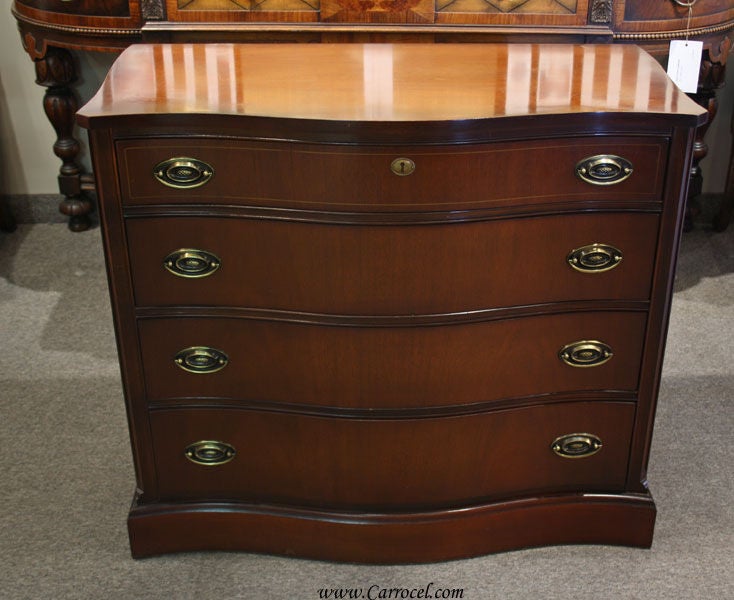 This is a solid mahogany bachelor's chest made by Bassett Furniture out of Basset, Virginia. Founded in 1902 by John David Bassett, Bassett Furniture is one of the oldest furniture manufacturers in Virginia and has been producing high quality
