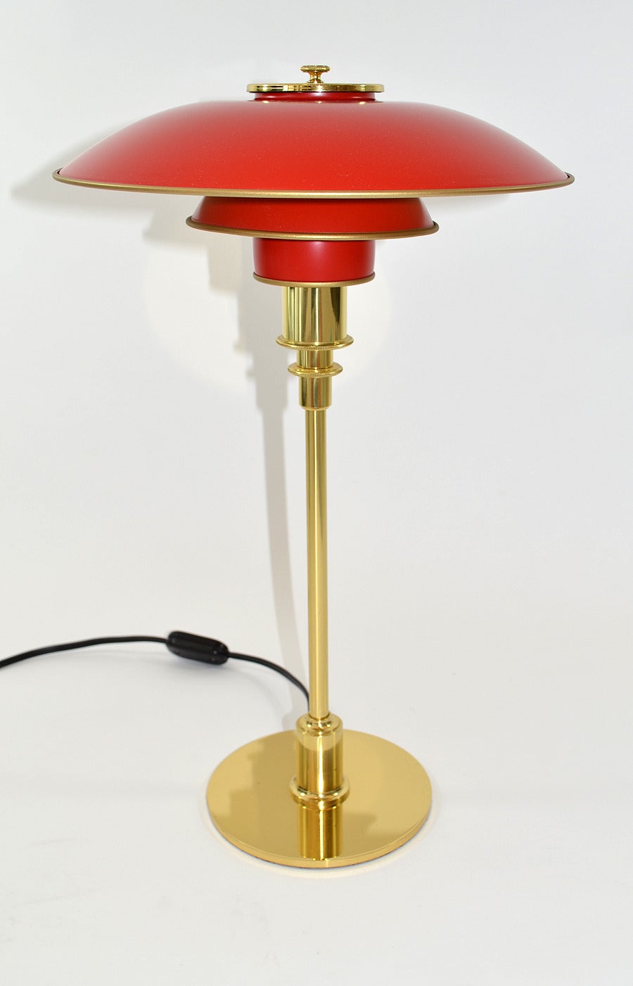 Signed and labeled Poul Henningsen PH 3/2 table or desk lamp by Louis Poulsen. Red enameled copper shades on polished brass stem, foot and socket cover. Louis Poulsen labels. Designed 1929. Late 20th century production.
