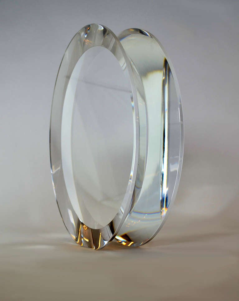 Large circular polished acrylic sculpture, yo-yo-shaped, designed by Alessio Tasca. Gorgeous optics with beautiful form and clarity. Signed. 
Measures: 12
