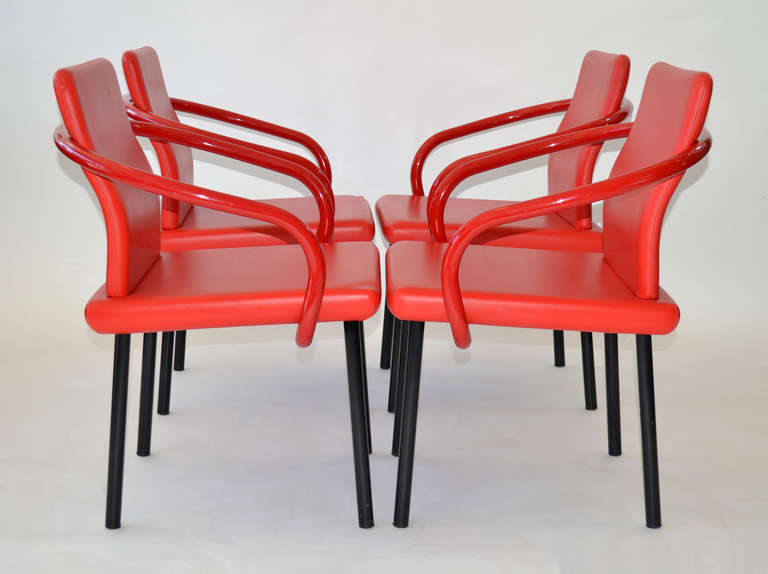 Set of four dining chairs designed by Ettore Sottsass for Knoll in red leather upholstery with black and red tubular steel frames.