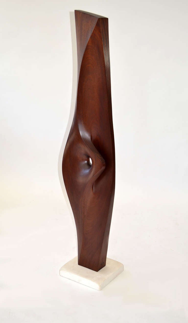 Sensuous wood sculpture by Henry Moretti in organic form carved out of Honduran Mahogany on a 12