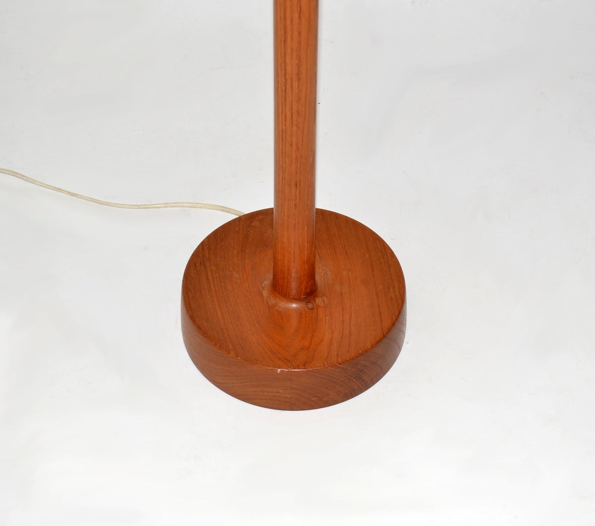 Masculine floor lamp by O¨sten & Uno Kristiansson for Luxus, Sweden - Teak frame with black leather shade. Labeled. Recently re wired with floor step switch on black cord. Please see detail of new bulb receptacle.
