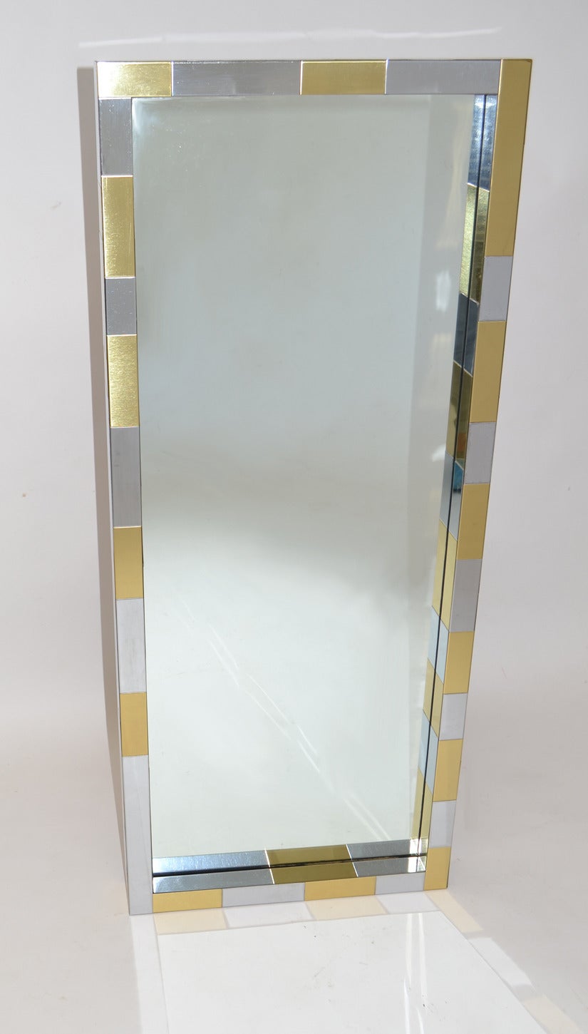Pair of Paul Evans Cityscape patchwork mixed-metal matching pair of mirrors in chrome and brass over wood. Very good condition. Versatile design for a number of spaces both vertical and horizontal.