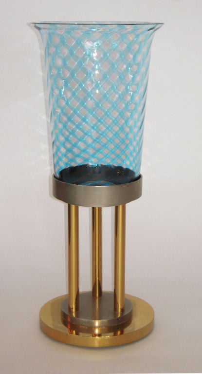 Large Italian Glass Vase or Votive on Brass and Steel Pedestal by VeArt
Large blue tone pattern glass vase, sits inside a very heavy and substantial solid brass and polished steel pedestal base. Signed. See our listings for another of the same model