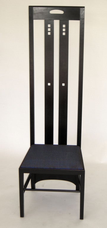 Charles Rennie Mackintosh, set of eight Ingram Tea Room high back chairs, 1910 (c. 1980’s), for Cassina. Black lacquered ash wood and upholstered seats. 

Charles Rennie Mackintosh designed the high back Ingram Chair around 1910 for the White