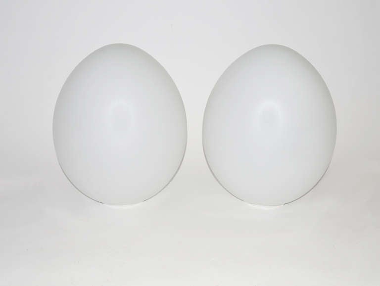 Over-size pair of 'egg' shaped Italian glass table lamps on white metal base. Labelled.