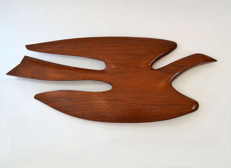 Large stylized sea bird wall sculpture in African Moringa wood by New England sculptor Clark Voorhees, signed.