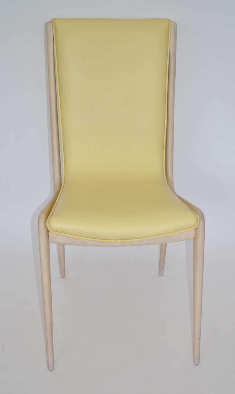 Set of eight sculpted walnut dining chairs, six side- (VK 101), and two arm- (VK 102) with sling upholstered seats in muted yellow leather. Fully framed with worked tapered legs and arms. Whitewash finish. An early organic design, hand-made in the