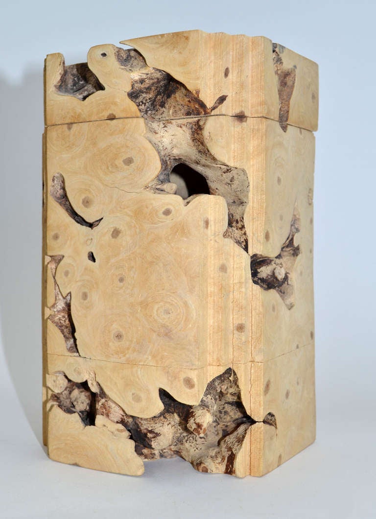 Sculptural lidded box carved out of a single piece of California Buckeye Burl. An exceptional piece, signed in the wood and also retaining the original mini information booklet.