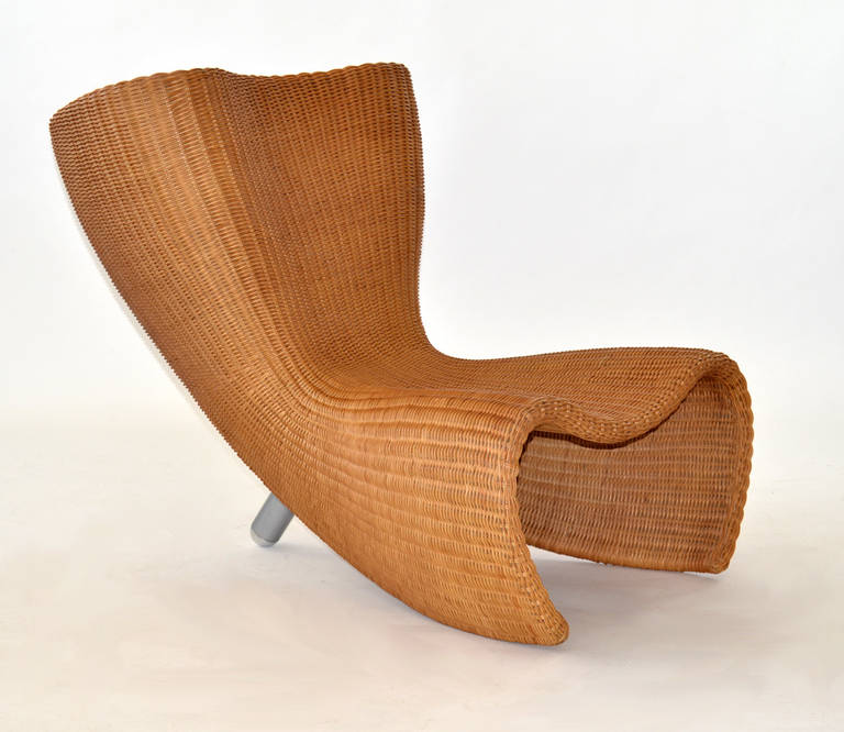 Marc Newson for Idee, Australia, circa 1990. Wicker and powder coated aluminum leg. Excellent condition. Sold with original customs documents.