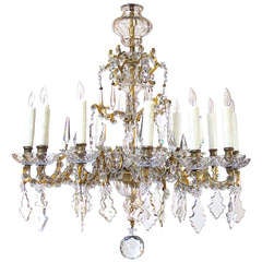 An Elegant Continental Rococo Style Gilt-Bronze 
Crystal 12-Light Chandelier