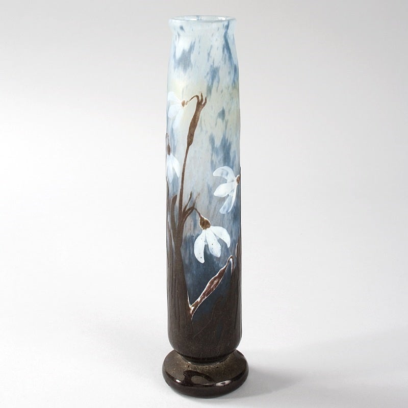 A French Art Nouveau cameo glass “Snow Drop” vase by Daum, featuring carved light blue flowers on brown stems against a mottled white and blue ground, circa 1900.

Signed, “Daum Nancy” with the Croix de Lorraine. 

A similar vase is pictured in: